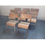EIGHT VINTAGE TUBULAR STEEL AND PLYWOOD SCHOOL CHAIRS