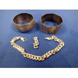 A SILVER CHAIN LINK BRACELET AND TWO SILVER NAPKIN RINGS