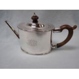 A SILVER TEA POT