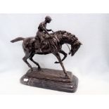 A BRONZE STUDY OF A RACEHORSE