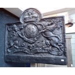 A REPRODUCTION CAST IRON FIRE BACK WITH ROYAL CREST