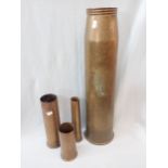 A LARGE BRASS SHELL CASE