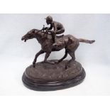 A BRONZE STUDY OF A RACEHORSE