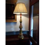 AN ITALIAN TURNED WOOD GESSOED AND GILT LAMP