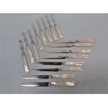 A SET OF EIGHT SILVER FRUIT KNIVES AND FORKS WITH MOTHER OF PEARL HANDLES