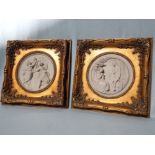 A PAIR OF REPRODUCTION RECONSTITUTED MARBLE RELIEF PLAQUES