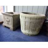 A WEATHERED RECONSTITUTED STONE GARDEN PLANTER