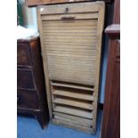 AN EARLY 20TH CENTURY OAK TAMBOUR-FRONT FILING CABINET