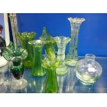 A COLLECTION OF EDWARDIAN GREEN GLASS VASES