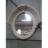 A PAINTED OVAL WALL MIRROR