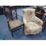 A VICTORIAN UPHOLSTERED ARMCHAIR