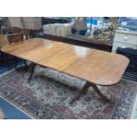 A LARGE GEORGE III STYLE MAHOGANY TWIN PEDESTAL DINING TABLE