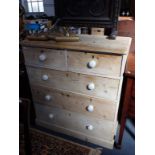 A VICTORIAN STRIPPED PINE CHEST OF DRAWERS