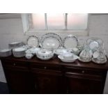 A ROYAL DOULTON 'BURGUNDY' DINNER SERVICE