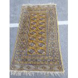 A YELLOW GROUND PERSIAN DESIGN RUG