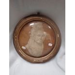 A FRAMED PLASTER RELIEF PORTRAIT