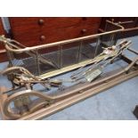 A 19TH CENTURY BRASS AND WIREWORK FENDER