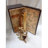 A 19TH CENTURY MONOCULAR MICROSCOPE BY BAKER