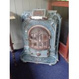 AN ENAMELLED CAST IRON BELGIAN STOVE