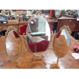 A TRIPLE GILT METAL DRESSING TABLE MIRROR