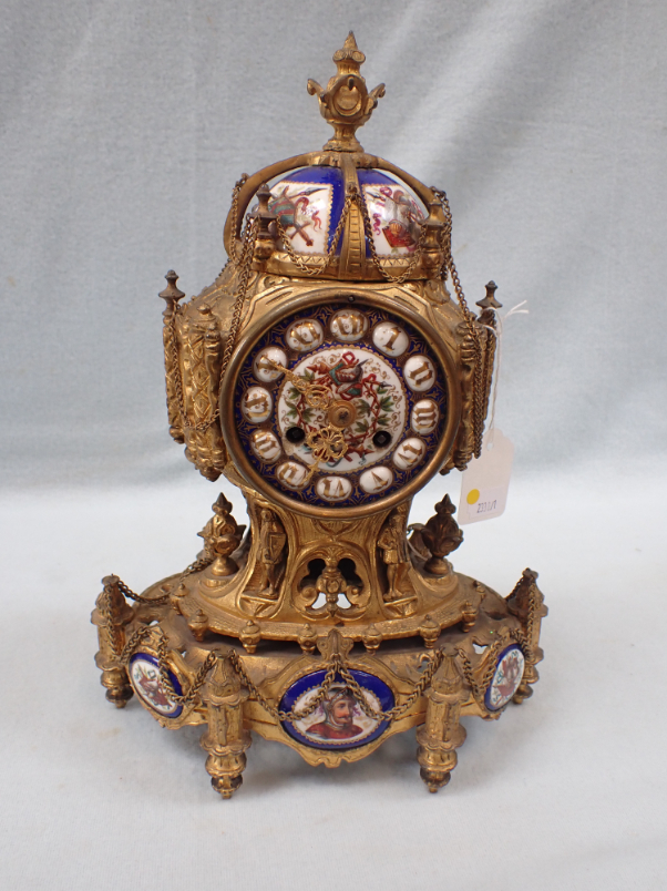 A 19TH CENTURY ORMOLU CLOCK WITH PAINTED PORCELAIN DIAL AND PLAQUES