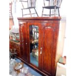 A MID 19TH CENTURY MAHOGANY TRIPLE WARDROBE