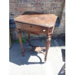 A VICTORIAN FIGURED WALNUT WORK TABLE