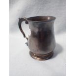 A SILVER MUG, WITH SCROLLED HANDLE