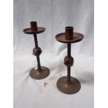 A PAIR OF PUGINESQUE CANDLESTICKS