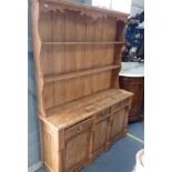 A 19TH CENTURY STRIPPED PINE DRESSER