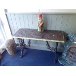 A VICTORIAN STYLE CAST-IRON GARDEN TABLE