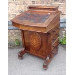 A VICTORIAN WALNUT DAVENPORT