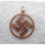 A 9 CT GOLD SWASTIKA PENDANT