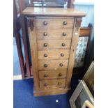 A VICTORIAN ROSEWOOD SEVEN DRAWER WELLINGTON CHEST