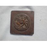A CAST BROZE PLAQUE: 'TAKE TIME BY THE FORELOCK' -'S.W.F.'