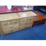 A LARGE CONTEMPORARY HARDWOOD COFFEE TABLE