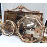 A GILT FRAMED WALL MIRROR WITH SWAGGED DECORATION