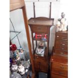 AN OAK BEDSIDE CUPBOARD