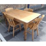 A VICTORIAN STYLE PINE KITCHEN TABLE AND FOUR CHAIRS