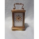 A MINIATURE CARRIAGE CLOCK