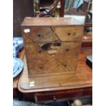 A SMALL JAPANESE PARQUETRY CHEST OF DRAWERS