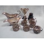 A SET OF SIX SILVER COFFEE CAN OR DEMITASSE HOLDERS