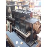 A LATE 19TH CENTURY "QUAINT" AMATEUR DESIGN EBONISED DISPLAY CABINET