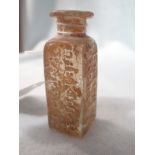 AN 18TH CENTURY MOULDED GLASS MEDICINE JAR