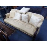 A VICTORIAN SOFA WITH CARVED WALNUT SHOW FRAME