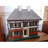 A LARGE 1930S DOLL'S HOUSE