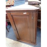 A GEORGE III MAHOGANY CORNER CUPBOARD