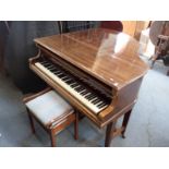 A NIENDORF BABY GRAND PIANO