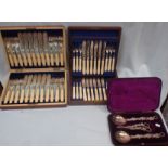 A CASED SET OF TWELVE SILVER-PLATED FISH EATERS