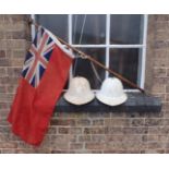 A RED ENSIGN ON AN ASH FLAGPOLE